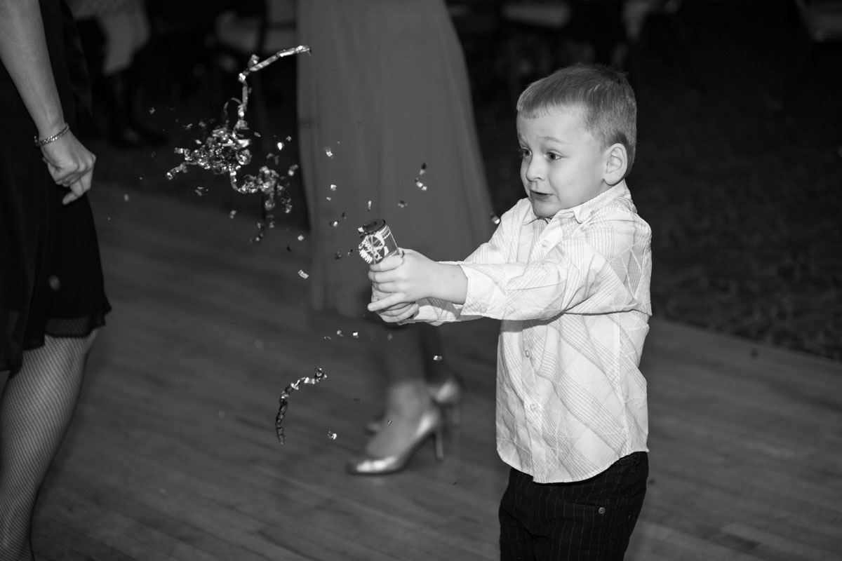 Kids being kids at your wedding on the dance floor through candid photography