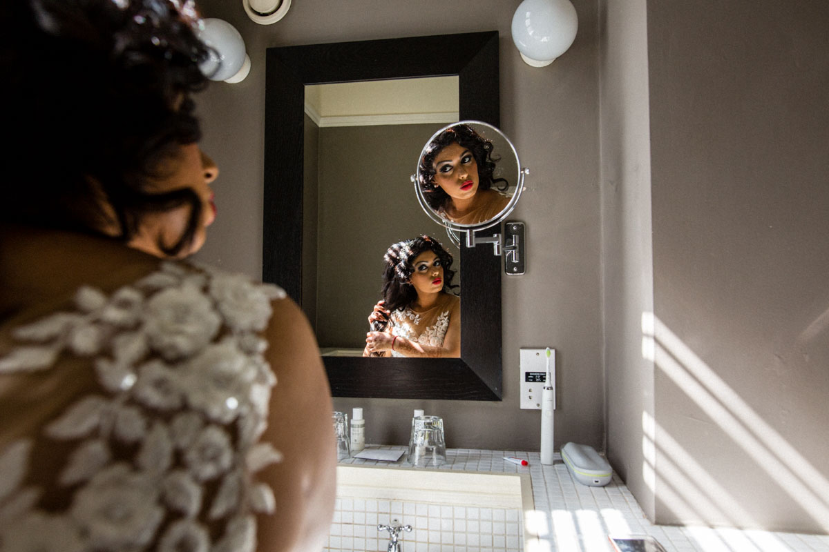 Use mirrors to add interest to bridal preparation shots